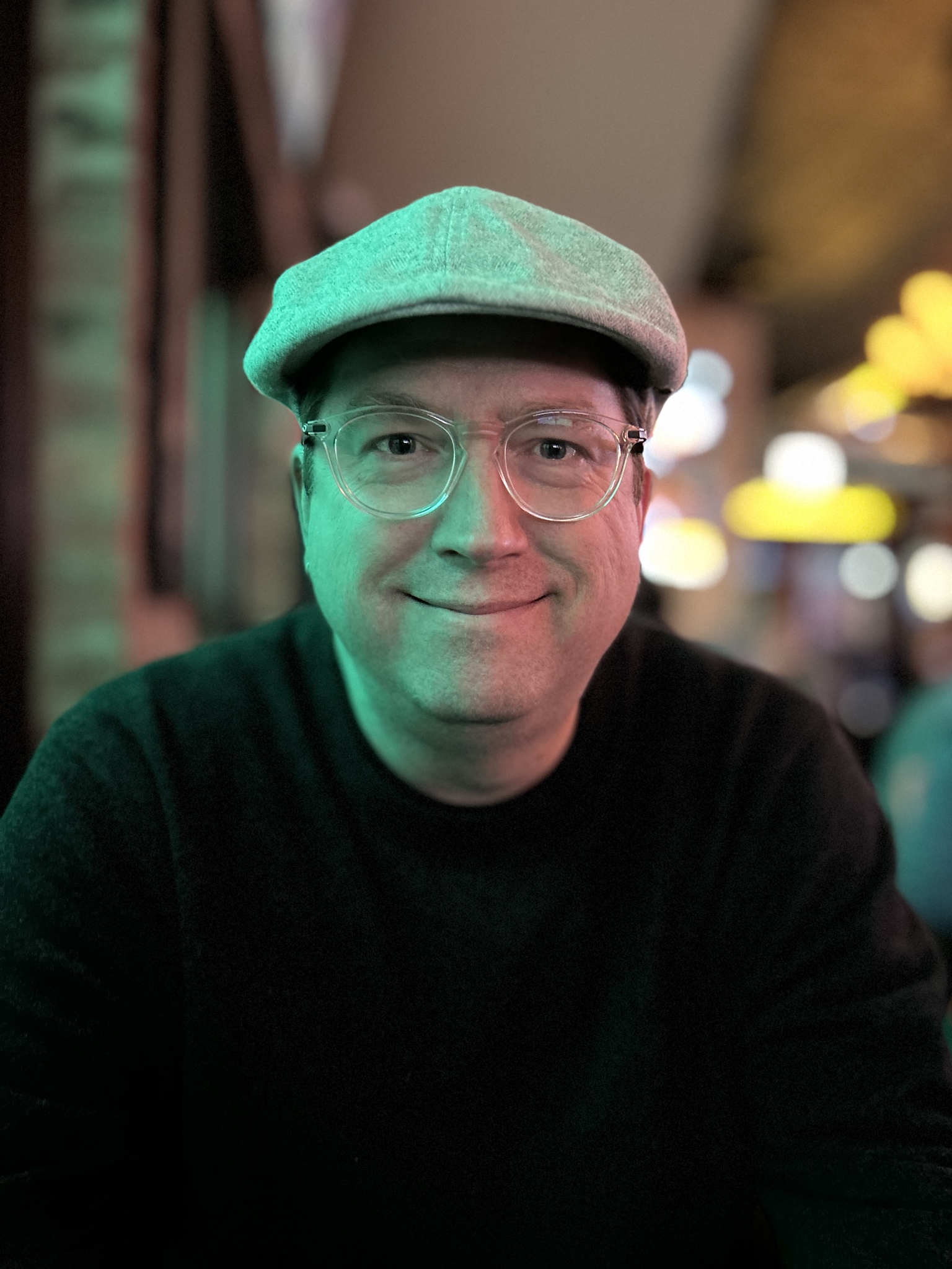 A portrait of Jeffrey Bardzell in a hat and wool sweater